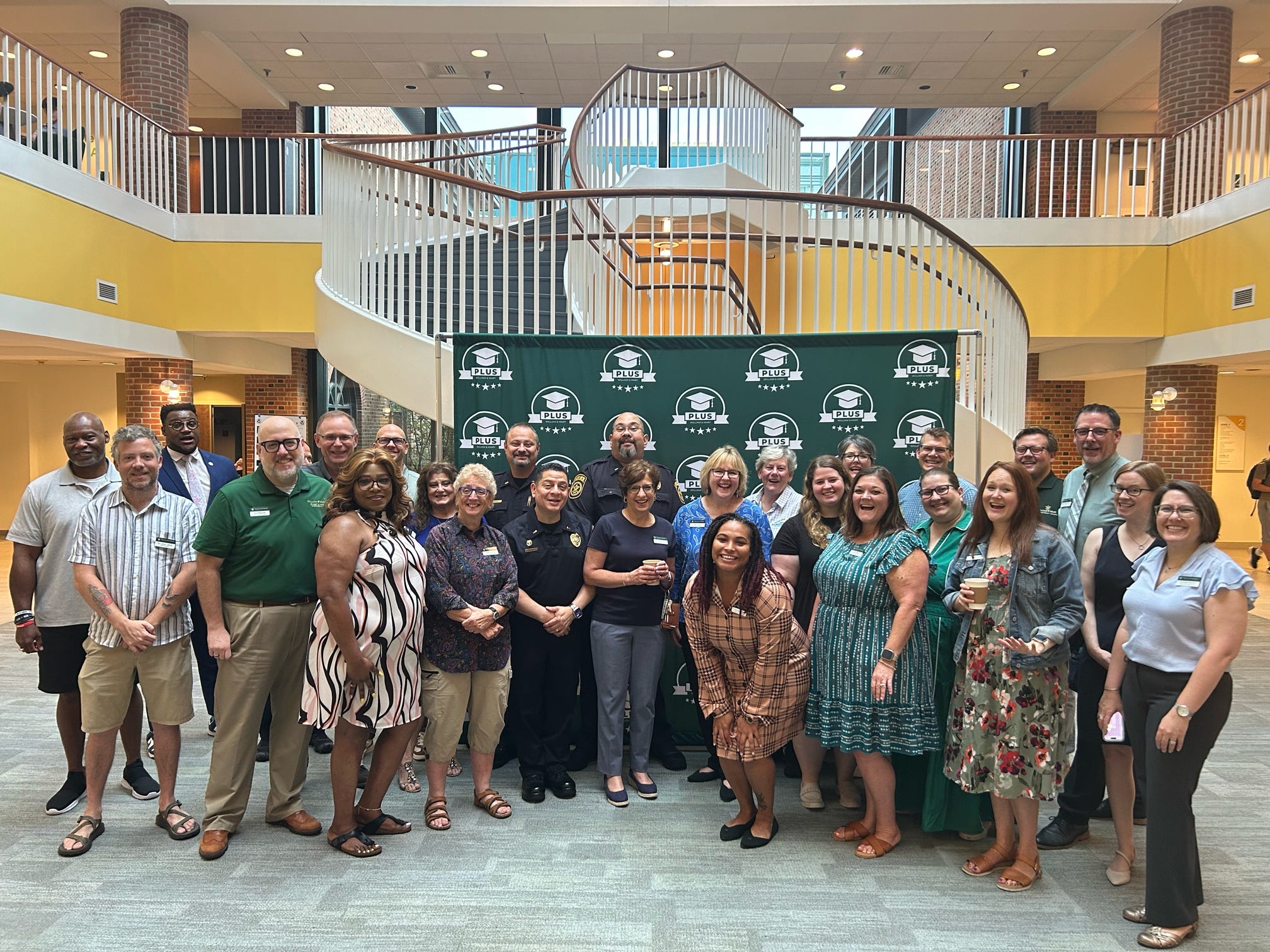 Student Affairs staff gather following a PLUS (Preparing for Life as a University Student) Networking Reception.