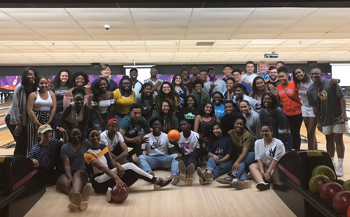 Students in the PLUS program pose for a photo at the bowling alley.