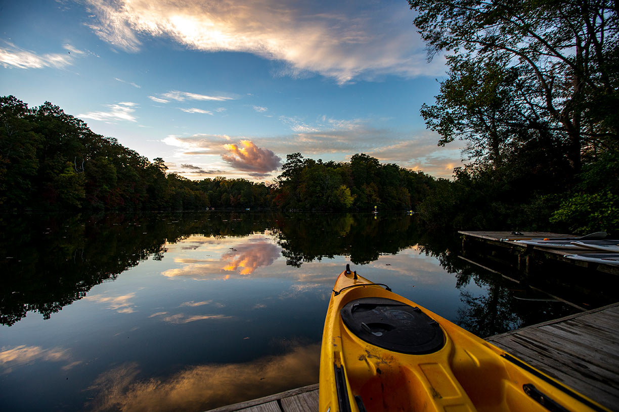 Lake Matoaka with a colorful sunset over the dock