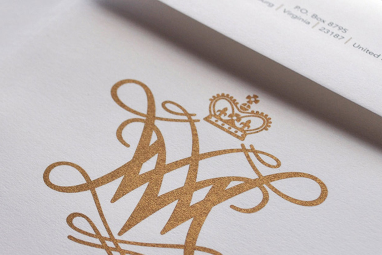 Gold cypher on a piece of stationary