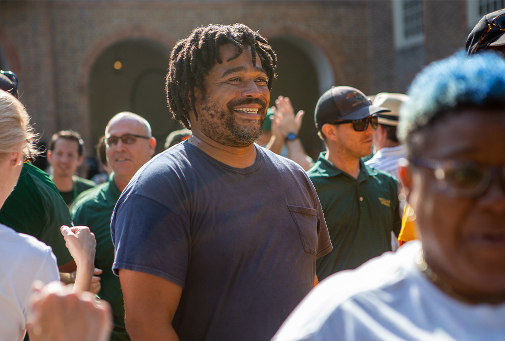 A William & Mary employee smiles at a staff event.