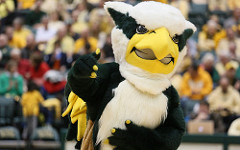 Griffin mascot waving in front of a crowd