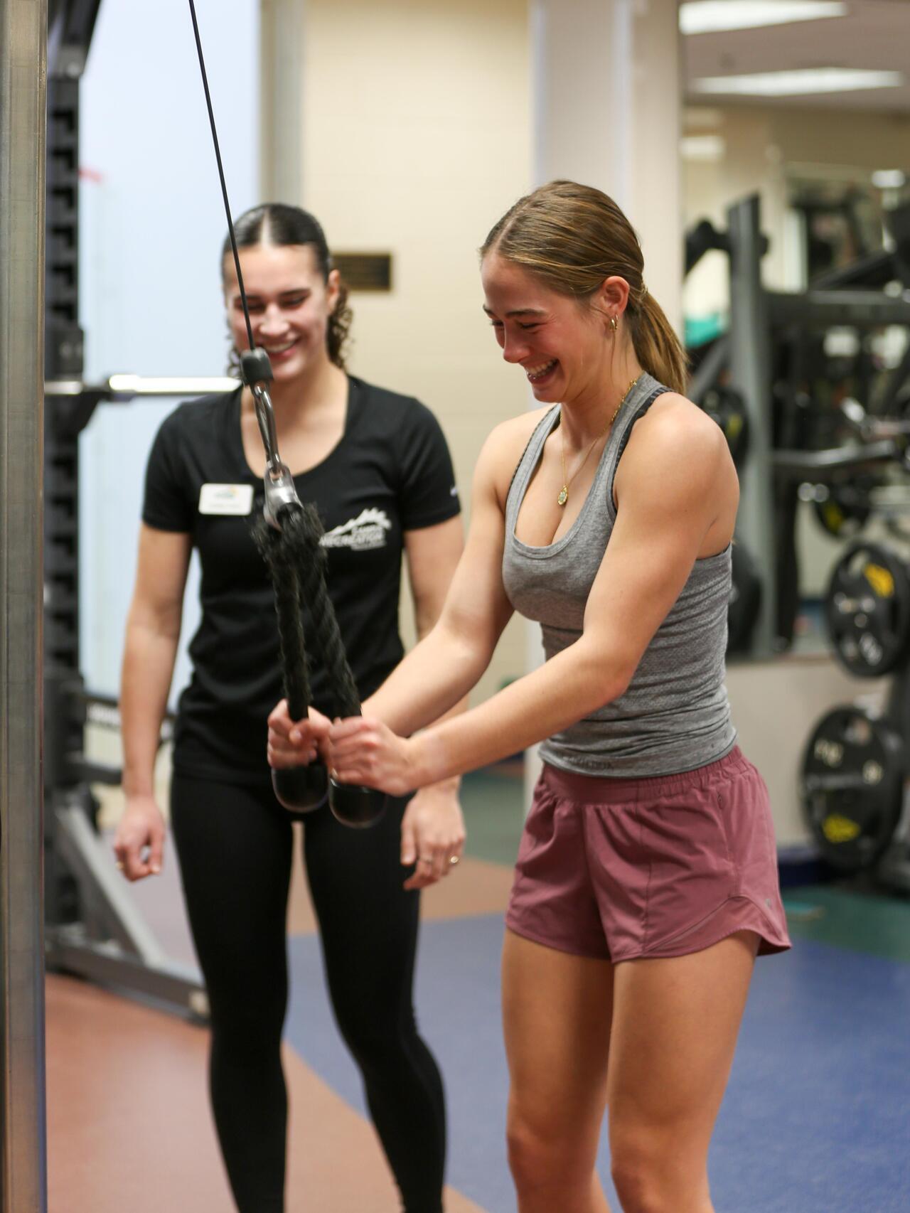 personal training session with a standing lat pull