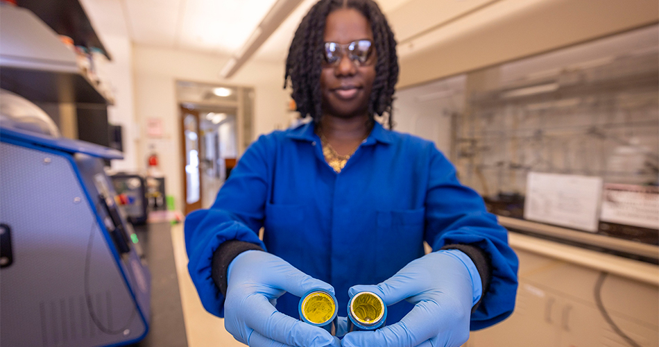 Brianna Furman ’27 holding a mechanochemical milling jar after a reaction.