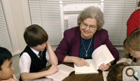 Joyce VanTassel-Baska works with children during one of the summer enrichment programs sponsored by the Center for Gifted Education.