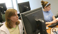 Peter Vishton works with a group of students in one of the new computer facilities in the ISC 2.