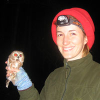 Erica Lawler holds a saw-whet owl just before release