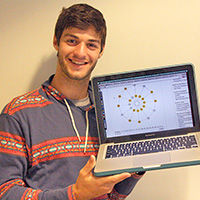 Math major Robert Torrence shows off his digital “New York Times” version of the classic Lights Out puzzle. 