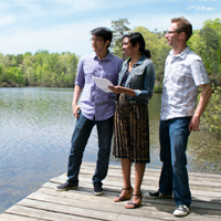 Faraz Rahman (left) and Jasmin Green, known collectively as “Jafar” look over the open water of Lake Matoaka with Kurt. 