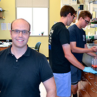Associate Professor of Chemistry Doug Young involves students such as John Halonski M.S. '18 (front) and Chris Travis '19