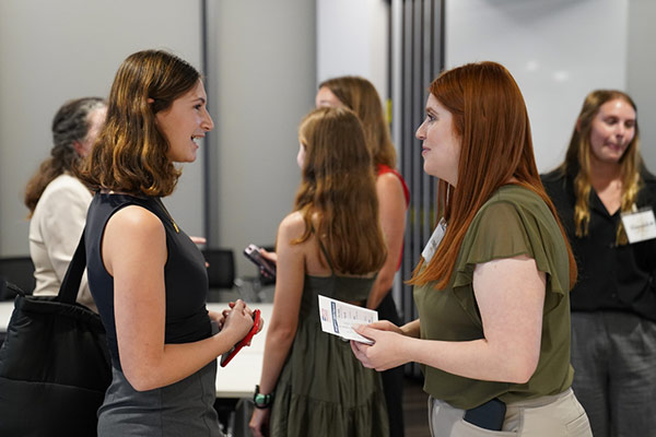 Students talking at a gathering