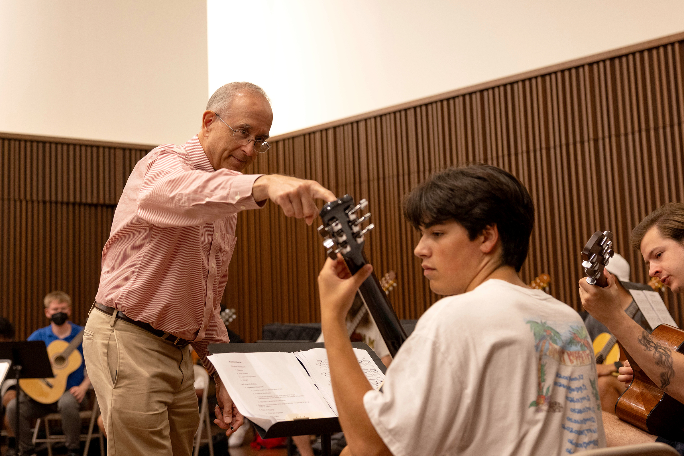 A professor and student in guitar class