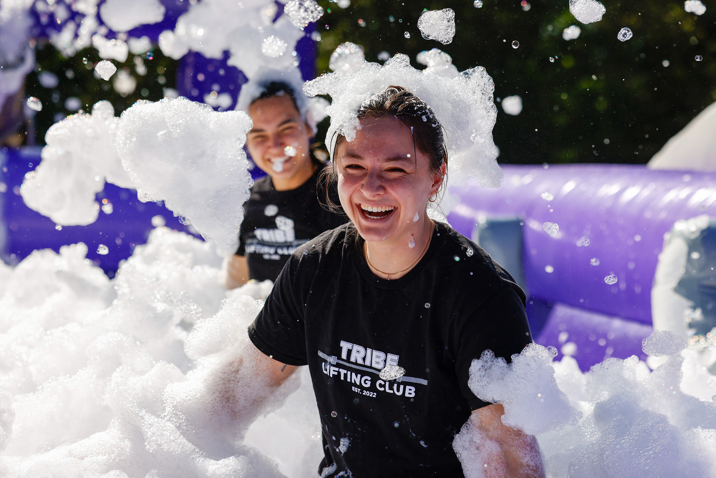 A student playing in a foam pit at the OTOD carnival