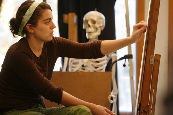 student_painting_looking_right_indoors