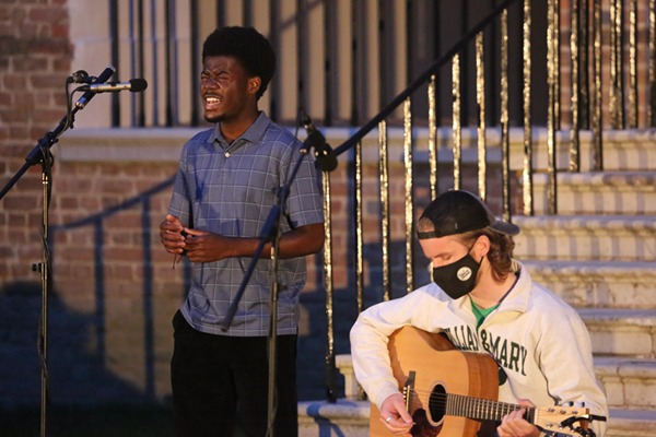 student_singing_playing_guitar