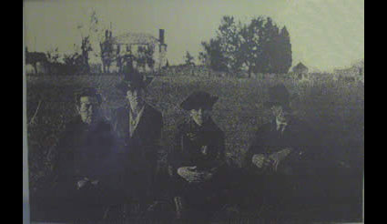 Weston Manor and several outbuildings appear in the background of this ca. 1916 portrait. It seems that the structures next to the house had been removed by this time. From left to right are William Ann Clark Redick Ford (her masculine first name honored her father, a Confederate soldier who died in battle before she was born), Ford’s daughters Gaynell Redick Warren, Redick McIntyre, and an unidentified man. (photo in possession of Historic Hopewell Foundation)