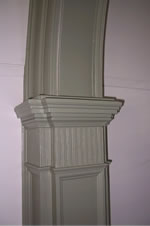 The passage also includes a central arch with a paneled keystone. According to oral tradition, the woodwork was crafted by Davy Friend, an African-American slave owned by relatives of the Gilliam family.