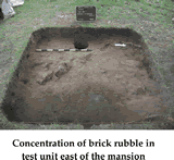 Concentration of brick rubble in test unit east of the mansion.