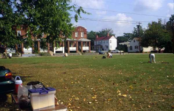 Archaeologists digging a grid pattern of shovel tests.