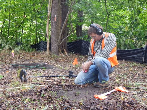 Each metal detector “hit” was assigned a number, marked with a pin flag for mapping, and the retrieved artifact placed in a bag with notations to indicate the location of the find.