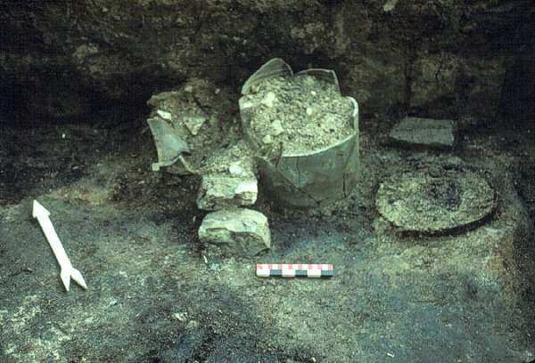 Ceramic crocks and barrel remain preserved on the cellar floor  of the upper structure, which burned in the 1880's.