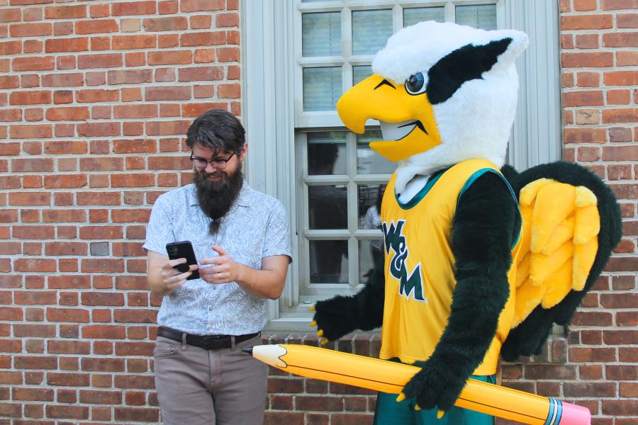 Griffin mascot poses with a Workday Project team member to celebrate the Pencil's Down milestone