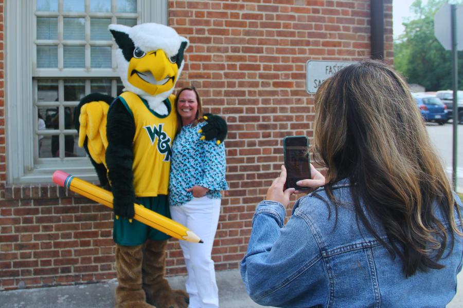Griffin mascot poses with a Workday Project team member to celebrate the Pencil's Down milestone