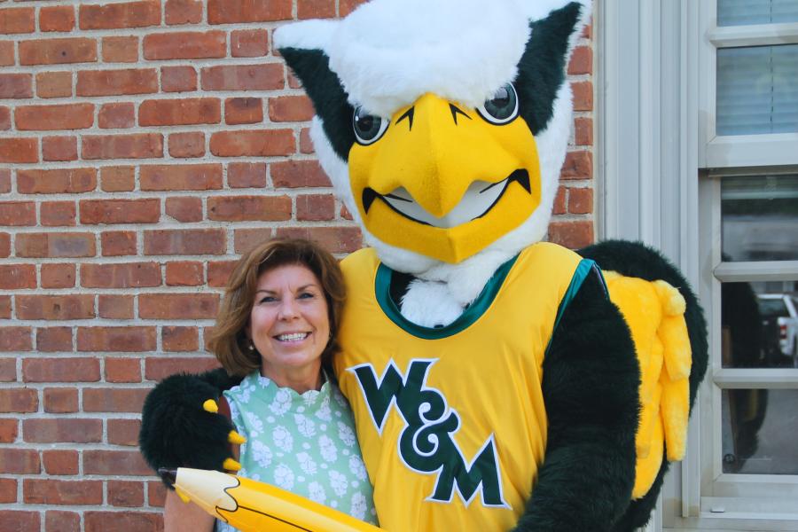 Griffin mascot poses with a Workday Project team member to celebrate the Pencil's Down milestone