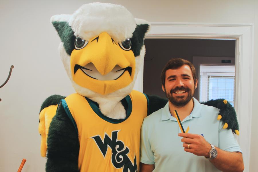 Griffin mascot poses with a Workday Project team member to celebrate the Pencil's Down milestone