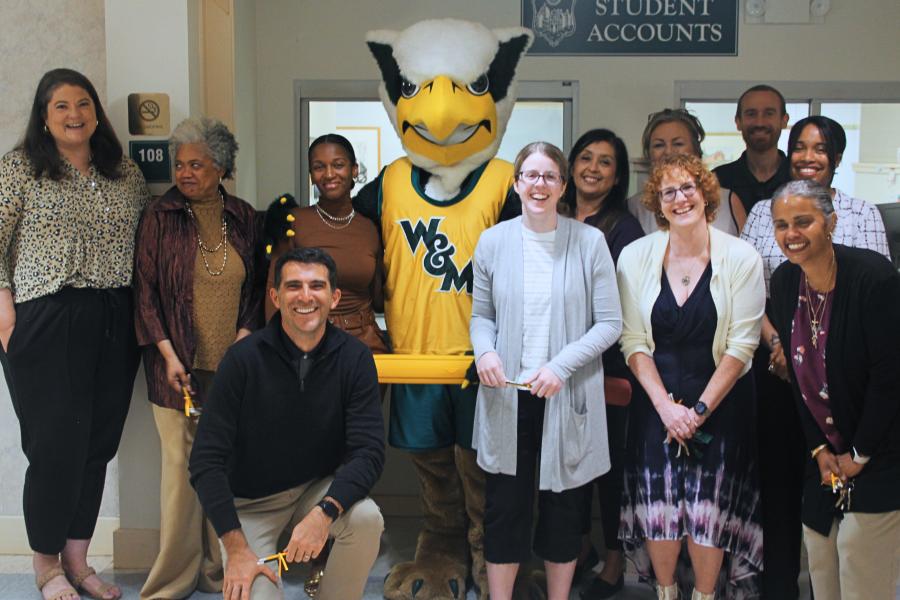 Griffin mascot poses with a Workday Project team member to celebrate the Pencil's Down milestone