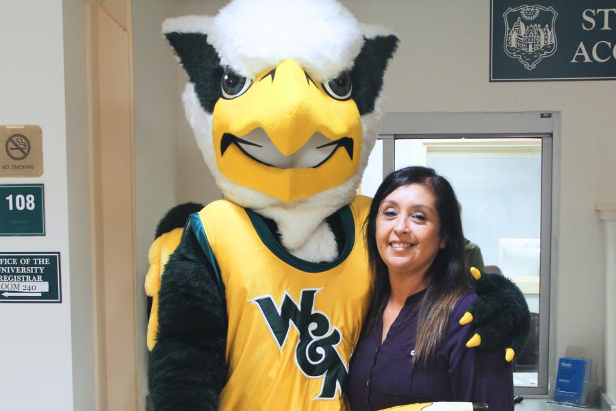 Griffin mascot poses with a Workday Project team member to celebrate the Pencil's Down milestone