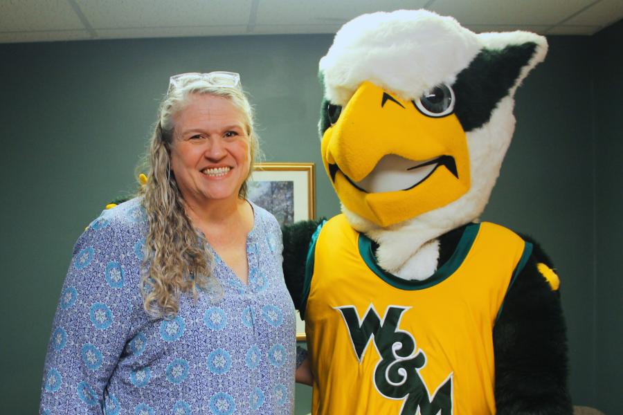 Griffin mascot poses with a Workday Project team member to celebrate the Pencil's Down milestone