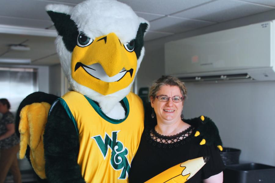 Griffin mascot poses with a Workday Project team member to celebrate the Pencil's Down milestone