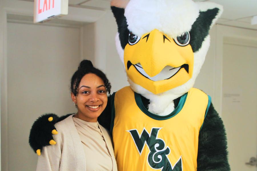 Griffin mascot poses with a Workday Project team member to celebrate the Pencil's Down milestone