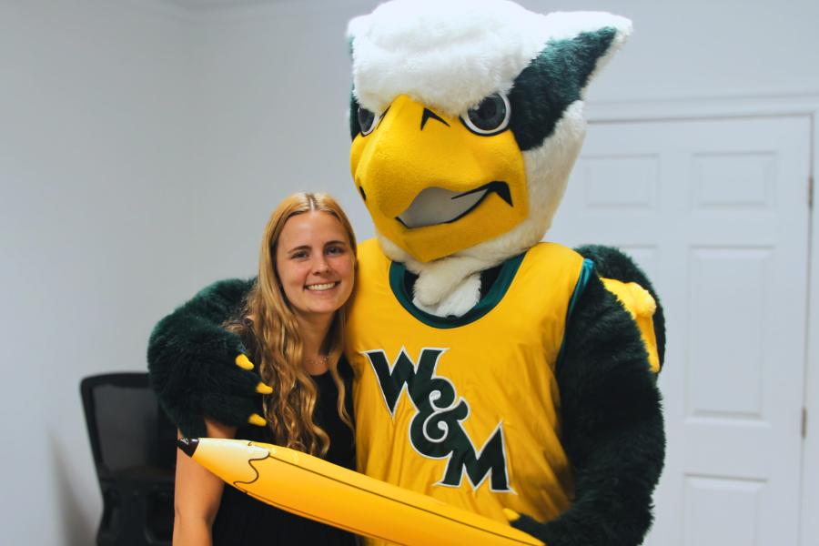 Griffin mascot poses with a Workday Project team member to celebrate the Pencil's Down milestone